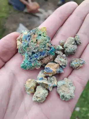 Corroded metal fragments in hand